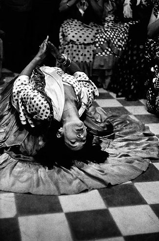 La Golondrina doing a floor backbend in Granada, Spain, in 1954. © The Inge Morath Foundation/Magnum Photos