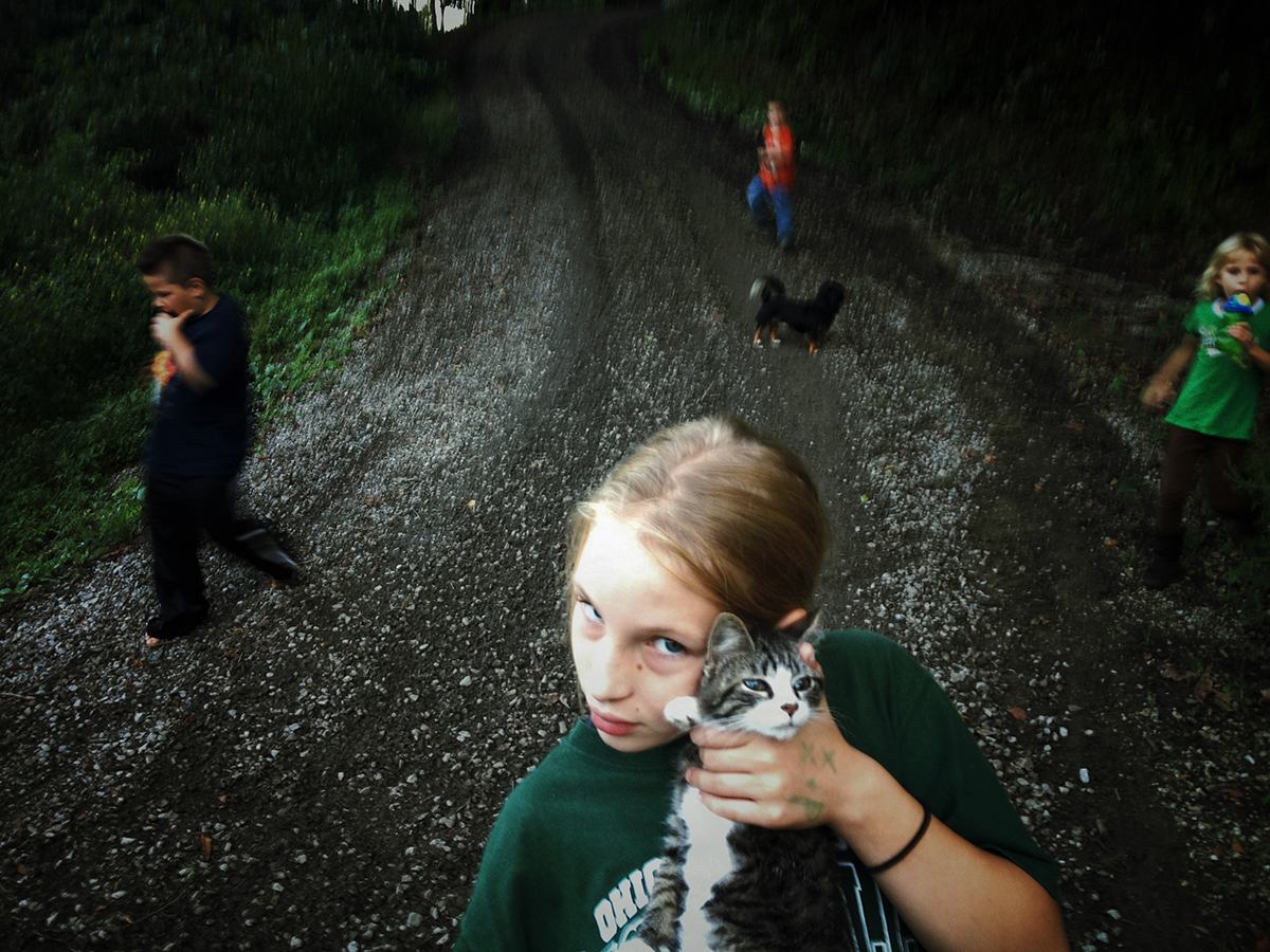 Sonya holds her neighbor's cat © Maddie McGarvey, 2014